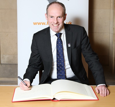 Justin Signs Holocaust Educational Trust’s Book of Commitment